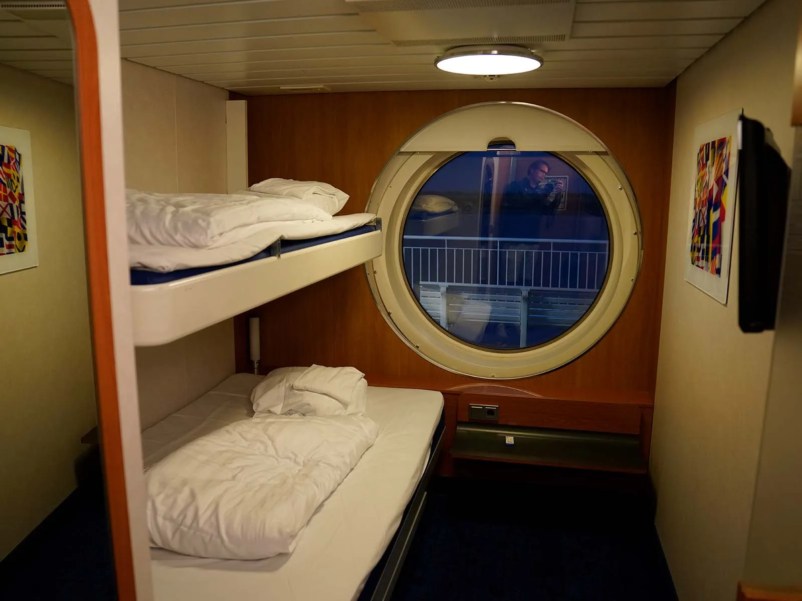An outside cabin with porthole on the night boat